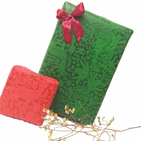 圣诞节设计花和礼物包装五颜六色的压花无纺布
